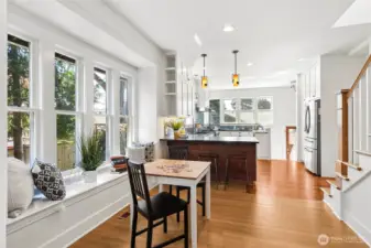 Open kitchen with multiple areas for sitting.