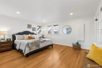 Huge primary suite that easily fits a king size bed plus more.