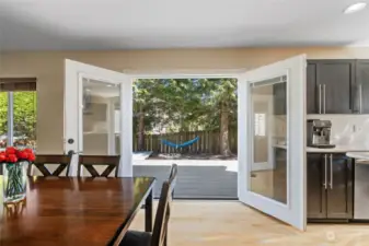 Step outside through the French doors onto the peaceful sanctuary in the back yard.