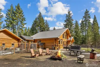 This backyard has it all. Multiple garden spaces, firepit, hot tub, deck and so much more!