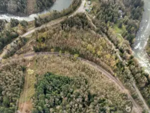 Aerial view, property is a cresent shape that follows the roads & railroad tracks (minus part of the corner where Galena rd & Hwy 2 meet)