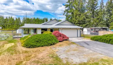 Cute, clean rambler with tons of parking and storage space on 1.21 acres!