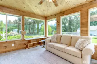Wonderful sunlit space with a ceiling fan, as well. Photos were taken with furniture in the home, but all pieces  furniture have been removed. The house is vacant and empty.