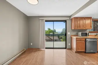 Kitchen eating area with slider to the back deck.