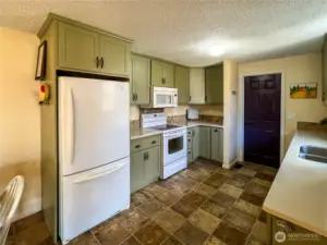 Updated Kitchen with access to Garage and Back Deck