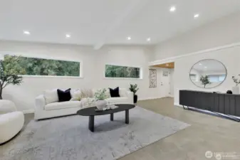 Bright and open living room with new flooring and paint.