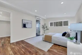 Relax and unwind in the spacious primary bedroom with serene views and natural light.