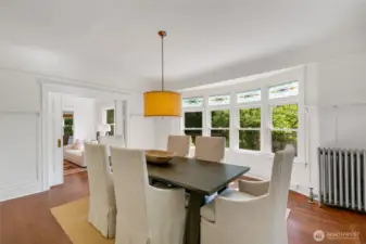 The expansive dining room is graced with stained glass windows and rich wainscoting - perfect for memorable gatherings