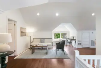 The expansive third-floor living area is filled with natural light and creates a bright and airy retreat