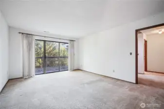 Primary bedroom w/ access to expansive deck.