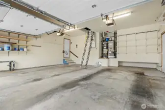 Oversized 2+ car garage with attic storage. Ladder/stairs are automatic with remote.