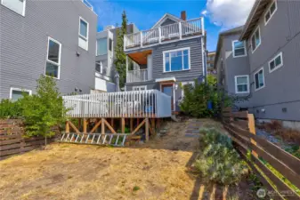 Spacious back yard with large deck area.