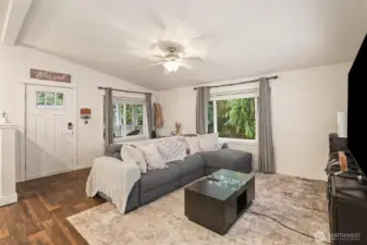 Living room anchored by natural light and positioned for comfortable gathering.