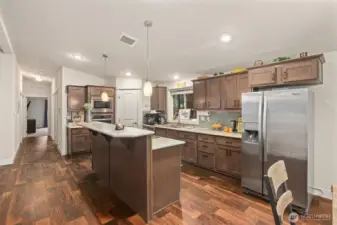 Spacious kitchen with large island, ample cabinetry, and generous prep space.