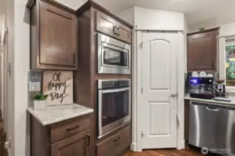 Built-in oven, additional cabinetry, and pantry storage for everyday convenience.