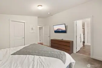 Primary suite with direct access to en-suite bath and organized storage.