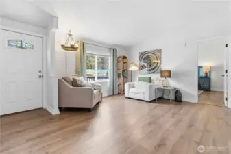 Primary bedroom is located off the living room and separate from the other bedrooms.