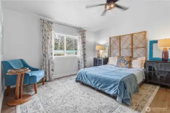 Spacious primary bedroom is light and bright!