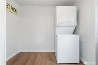 Spacious utility room off of kitchen opens up to the back deck.