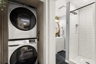 Primary bathroom with laundry. Avoid your clothes from piling up and just toss it right in the wash! :)