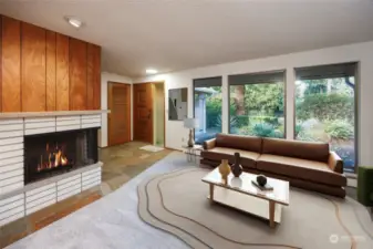 Living room with gas fireplace, big picture windows facing North towards front yard and Wildwood Park