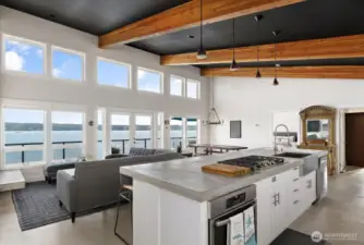 Look at those gorgeous dramatic exposed wood beams! You’ll love the crystal White quartz countertops, soft-close Belmont cabinetry with pull-out shelves, and elegant lighting by Rejuvenation.