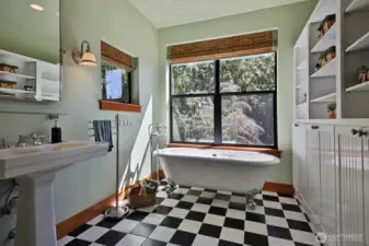 Tile floors, claw tub and walk-in shower. Plenty of built in cabinets for storage.