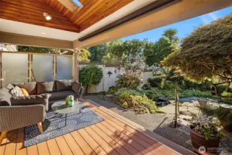 The covered porch off the living room has skylights to take advantage of all the natural light.
