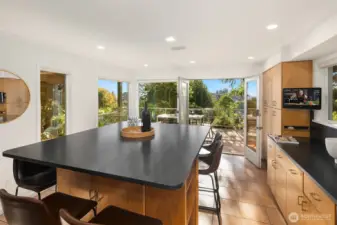 French doors from the kitchen open to the view deck.