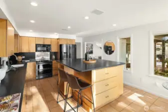 The center island has space for both seating and storage.