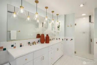 The primary bathroom has double sinks, a jetted shower, separate jetted tub and bidet toilet seat.