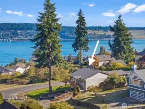 Mt. Rainier and Puget Sound frame this reimagined Fox Island home on a private corner lot