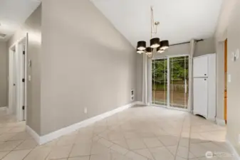 Formal dining room is open to backyard and kitchen.