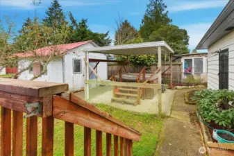 Workshop (could use some love) and covered patio with hot tub