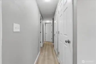 Hallway on main leading to bedrooms and shop area