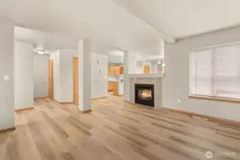 Living room/dining room share a wonderful pass-through gas fireplace.