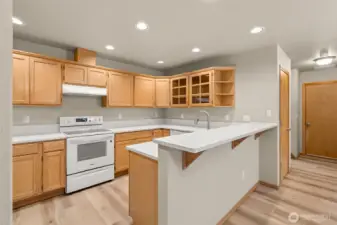 Kitchen has been refreshed with quartz countertops, deep stainless-steel under mount sink and new range and dishwasher.