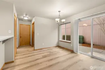 Dining room with slider door that leads to private patio area