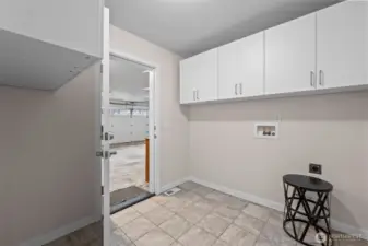 Separate laundry room has its own no-step door leading into garage.