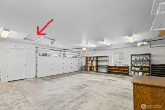 Main double-wide garage door, wide walk-door, and access ladder to large bonus unfinished room are all shown here. Attic space picture is coming soon (missed in the photo shoot).