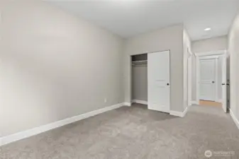 the second primary suite on the main level with a full bath