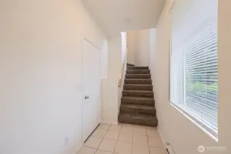 Entry. One of 2 sets of stairs up to the living space.