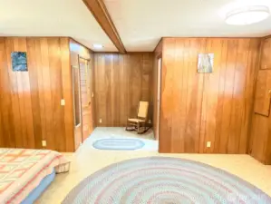 Very spacious primary bedroom suite with walk-in closet on the left and 3/4 bath on the right.