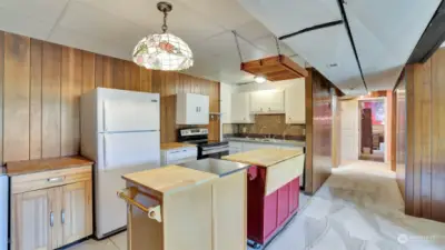 Kitchen on lower level offers the possibility of multi-generational living or potential for additional income (buyer to verify).