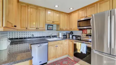 Updated kitchen with ornate tile backspace.