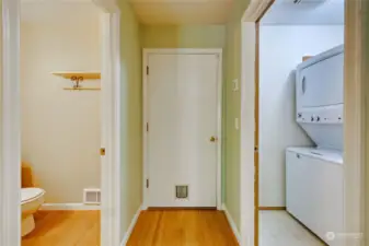 Off from the living area is a 1/4 bath and utility room leading to the garage.