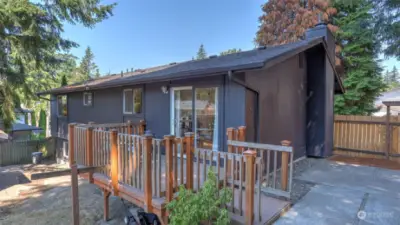 Enjoy hosting all summer long on this deck and patio space just off the dining room.