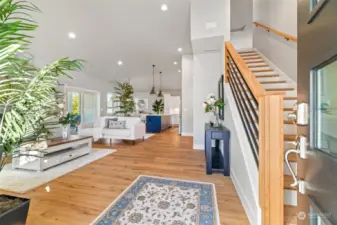 Step into a bright and airy living room, where high ceilings and natural light create a warm, welcoming ambiance.