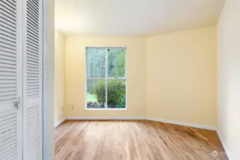 Bedroom nearest the living room, with view of creek