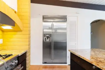 Sunken refrigerator with storage closet to right